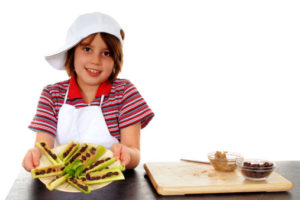 child making ants on a log snack