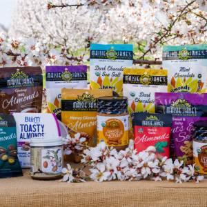 variety of nut products with almond blooms in an orchard