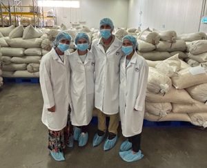 Hurtado girls and Isidro in the Cashew plant